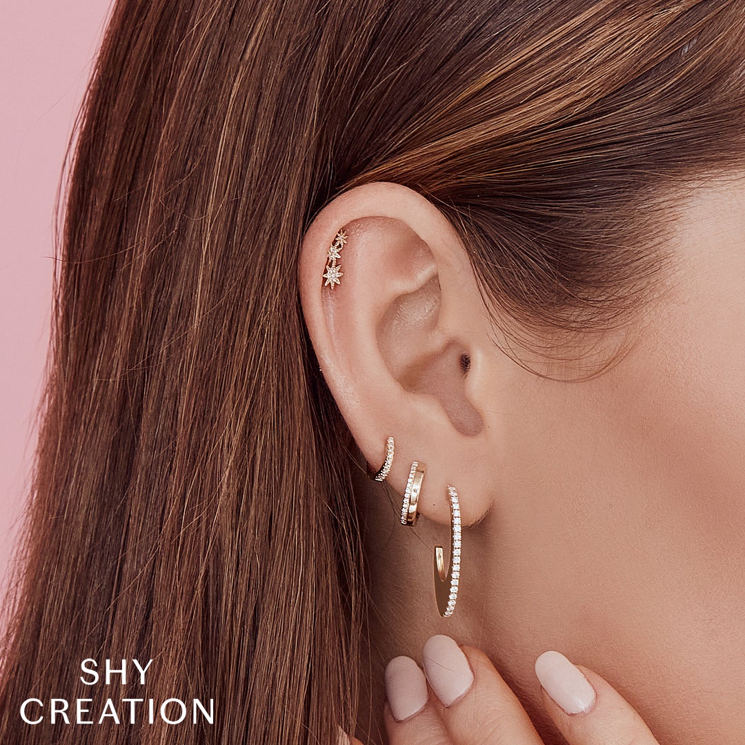 0.34CT DIAMOND OVAL HOOP EARRING