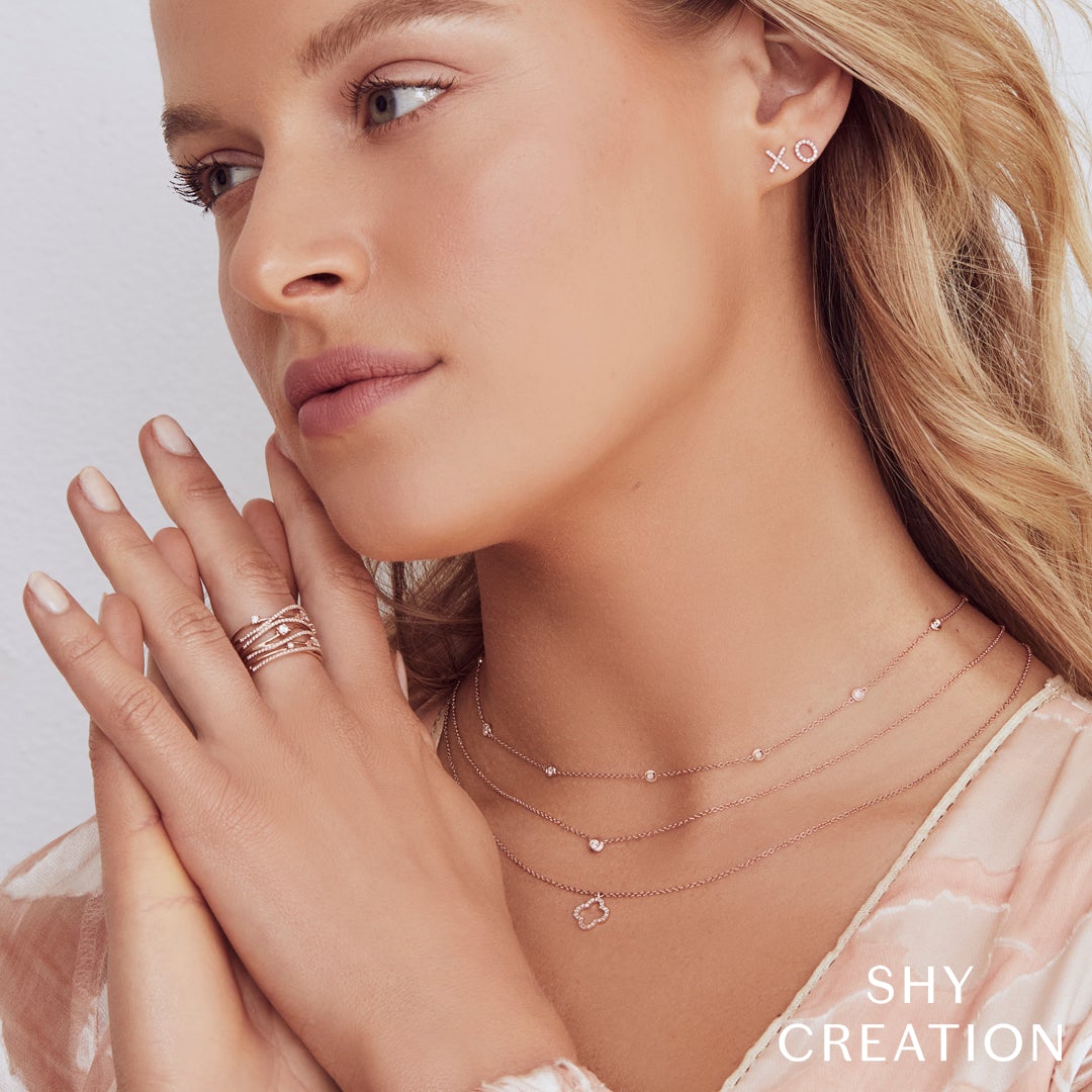 0.49CT DIAMOND BRIDGE RING